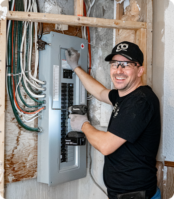 Electrician working on an electrical panel 