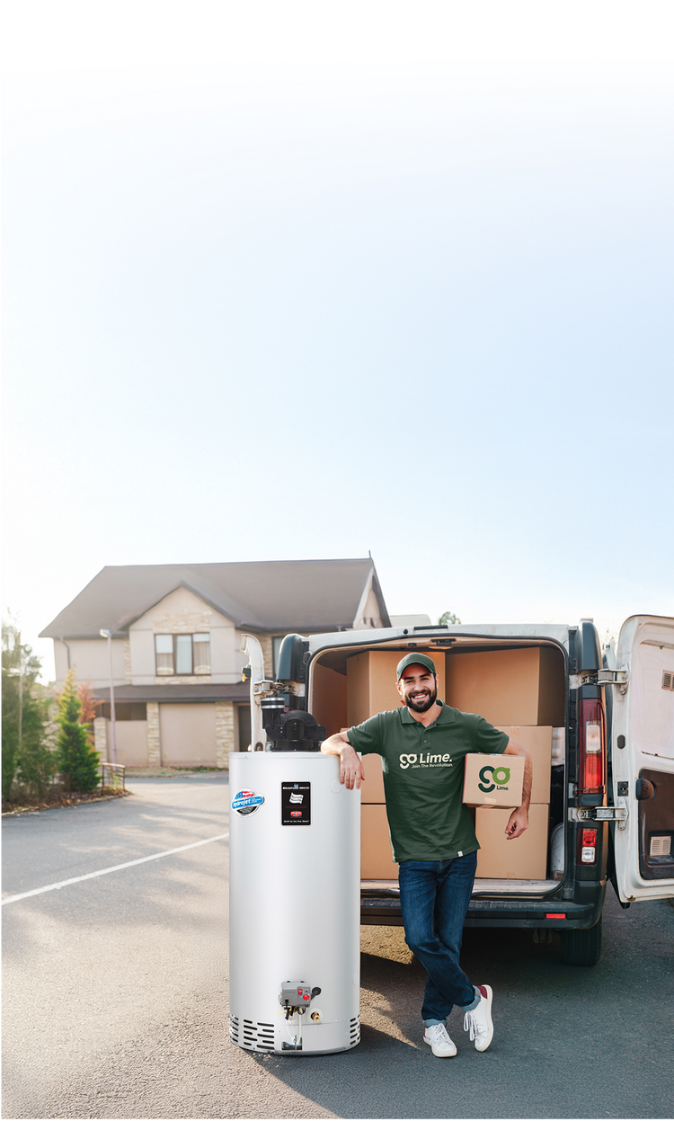 Man standing next to a water heater