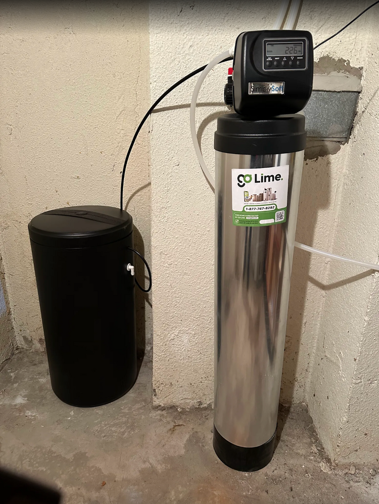 Spa or pool water filtration system with a digital timer against a concrete wall