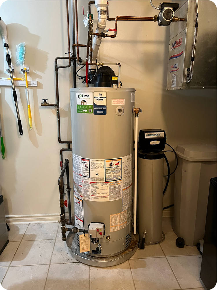 Gray water heater with various labels in a utility room setting.
